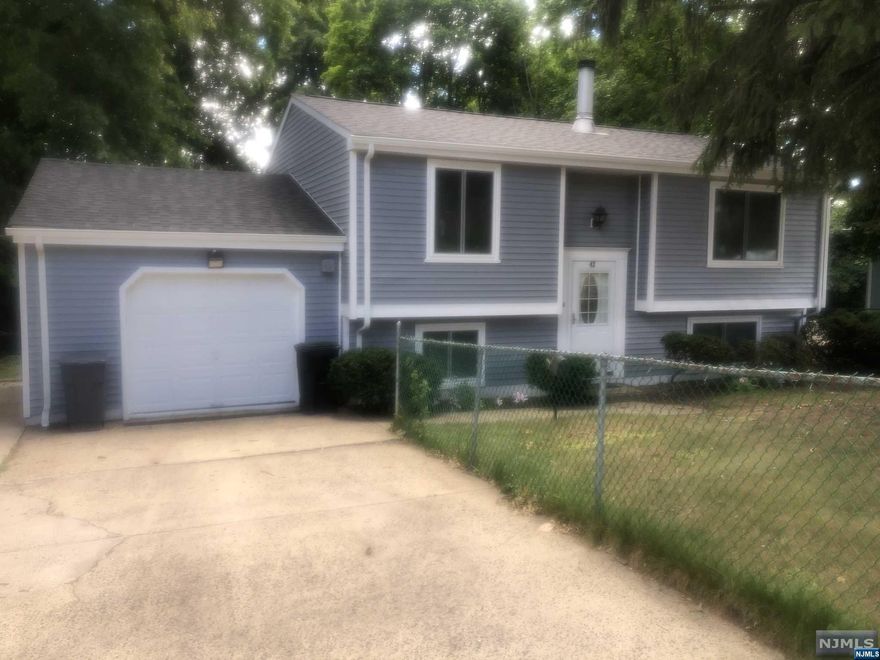 A Lovely large Bi-Level in move-in condition perfect Mother/Daughter, Father/Son, New roof 3 months old Deck 2 months old. Features triple pane windows French drains with a sum pump, brand new hardwood floors on the upper level and brand-new carpet on the lower level, wall pool hot tub, woodburning fireplace, and Central Air and Central Heat. House is walking distance to New York City Trains and Buses. Great Location close to public transportation, parks schools and places of worship. Huge backyard great for outdoor entertainment and leisure. One room is an office but could be used as a 4th bedroom.