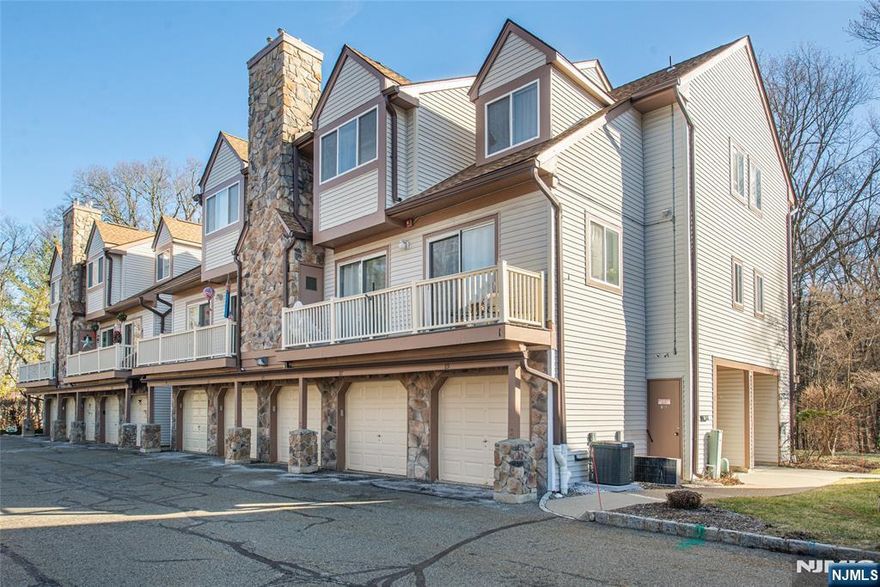 Don't miss out on this rare two bedroom, two full bath ranch style unit in The Meadows that backs up to the woods! The bright, open layout features vinyl flooring throughout the main living areas and cozy carpeted bedrooms, along with plenty of closet space, including a spacious walk-in closet. The well-appointed kitchen comes equipped with a gas stove, refrigerator, and dishwasher, while the living room offers a gas fireplace and opens through sliding glass doors to a back patio, perfect for relaxing or entertaining. Additional highlights include forced hot air heat, central air conditioning, and a detached garage for added convenience. Enjoy HOA amenities and an ideal location just minutes from schools, transportation, and shopping. This move-in-ready townhome combines comfort, convenience, and low-maintenance living in a prime setting.