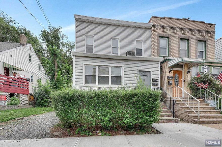 Beautiful opportunity to own an amazing two family home with two car detached garage. Property has separate utilities, gas, electric, hot water heater and boilers. Street views overlook Manhattan. Access roads lead to Edgewater and Cliffside Park including transportation. Please note seller is a licensed Real Estate Agent. A MUST SEE NOW!