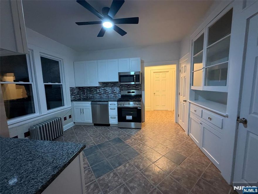 Stunning fully renovated 3-bedroom, 1-bath second-floor apartment in Lower Vailsburg. Move-in ready with a brand-new modern kitchen featuring white shaker cabinets, granite countertops, stainlesssteel appliances, and subway-tile backsplash. Spa-like bathroom boasts a unique blue glass vessel sink, matte black fixtures, and classic black-and-white octagon mosaic flooring. Beautiful hardwood floors flowthroughout, high ceilings, fresh paint, and abundant natural light from oversized windows. Spacious bedrooms with excellent closet space, exposed brick accents, and charming historic radiators. Convenientlylocated on tree-lined Grand Avenue near shopping, dining, Seton Hall University, public transportation, and major highways with easy access to NYC. Fresh, clean, and delivered vacant " ready for immediateoccupancy! This one won't last long!