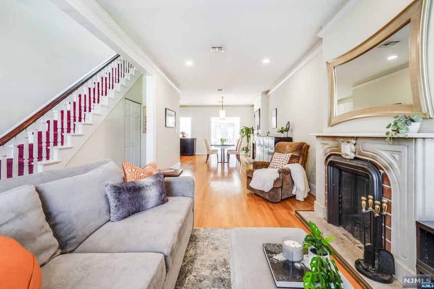 A commuters dream! Unique and rare opportunity awaits at 49 Van Reipen Ave! Exuding original charm at every turn this Brownstone multi-family residence, unfolds over three floors, revealing 3 bedrooms and 3 baths. As you step through the entrance, the parlor level unfolds into a spacious haven featuring an open-concept living room, dining room, and kitchen adorned with remarkably high ceilings. A sense of history and elegance pervades, accentuated by an original fireplace in the living room. Beyond the kitchen lies a sunroom, adorned with floor-to-ceiling windows, a sunlit sanctuary seamlessly connecting to the expansive backyard. Ascend to the second floor, where three generously sized bedrooms, and a full bath await. The ground floor unit features one bedroom, one bathroom, and a full kitchen. The space works perfectly as an investment rental to offset expenses, or mother-in-law suite. This prime location offers walkable access to fine cuisine, nightlife, and shopping, ensuring