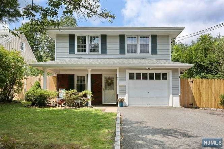 Beautiful Raised Ranch offering many updated features throughout. This lovely home welcomes you into a spacious entry foyer, huge family room (currently being used as master bedroom) with crown molding and sliders leading to Blue Stone patio and fenced-in yard, den/office, powder room and laundry on the lower level. The upper level offers a Granite kitchen with breakfast bar, bright living room/dining area with hardwood floors, master bedroom plus 2 additional bedrooms and full bath. Attached garage, multi-zone CAC and more... Conveniently located close to NYC transportation, shopping, schools, parks, and houses of worship. Extended family possibilities.