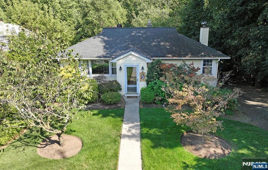 Welcome to this inviting 2-bedroom, 2 full bath ranch nestled in one of the most sought-after communities in Bergen County. Step inside the vestibule to LR, DR, MEIK and bright & sunny FR overlooking the expansive 300' property providing serene views and plenty of space for outdoor enjoyment. 2 bedrooms, full bath and deck completed this level. The lower level features a second family room with wood-burning stove, full bath with stall shower, laundry, utilities and one-car garage adding convenience and storage. Don't miss this opportunity to enjoy all that Glen Rock has to offer including a vibrant downtown center, great commute by train and bus and award-winning schools. Come see for yourself!!