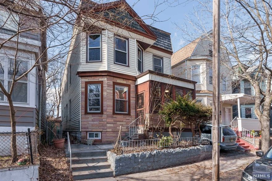 Welcome to 75 Girard Ave East Orange, located off Dodd street. This is a legal two family house that was recently renovated. First floor has a nice sized living room, formal dining room, two bedrooms, beautiful bathroom with some nice tile work, you will love the kitchen, with new countertops, granite countertops, beautiful back splash, which is breathtaking! New appliances, new tile flooring, most of the windows are new, flooring are new. Second floor could be three bedrooms if needed or use with living room and formal dining room. beautiful bathroom with some nice tile work, you will love the kitchen, with new countertops, granite countertops, beautiful back splash, which is breathtaking! New appliances, new tile flooring, most of the windows are new, flooring are new. First and second floors are fairly similar. There is a small porch on first floor. The heating system is gas steam heat. The two car garage at back of house is now mostly used as storage space. This is a must se!