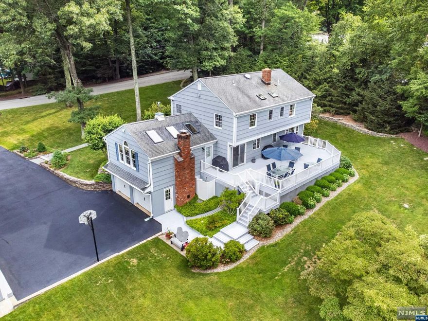 Exquisite Center Hall Colonial. Plus a Potential MOTHER Daughter situation. This amazing property has so much to offer. The moment you enter this home you are in awe. A Beautiful Living Room and Dining Room that offers a large space for entertaining. Half bath located on the first floor. The Eat in Kitchen has electric cook top with oven. Microwave, dishwasher, refrigerator. Granite counter tops, Slider doors in kitchen that open to Deck overlooking beautiful private yard with woods. Large great room off of the Kitchen. Gas fireplace, ceiling fan, three skylights that have electric shades. The Great room has closets for storage. Master Bedroom has bathroom. This home has a total of 4 bedrooms all on the second floor. Two full baths on the second floor. The basement offers an additional sitting room (bedroom), laundry room, full Bath, utility room. Walk out to the garage. A large deck that overlooks the beautiful back yard. The Back Yard privacy is enhanced by Water Shed.