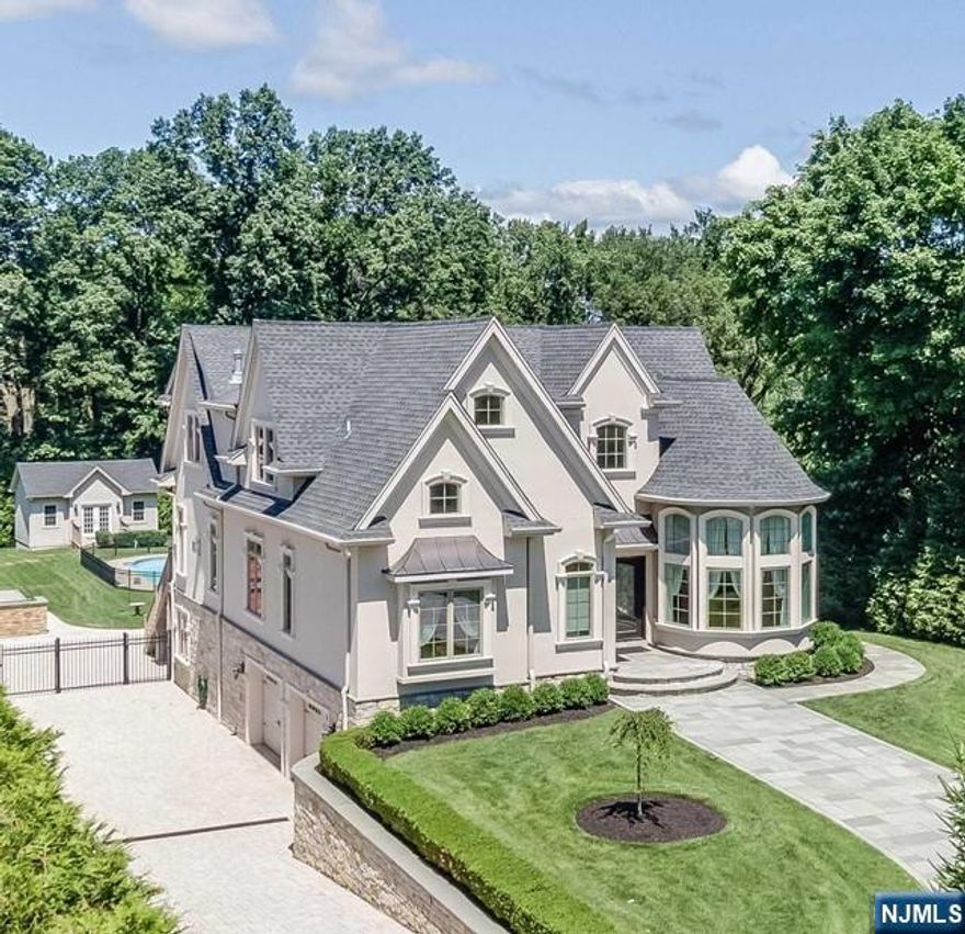 Welcome to NORTH CALDWELL 3900sq/ft, custom French chateau, where elegance meets luxury was built on oversized lot 93x393. The first floor features a grand double-story foyer, a spacious office, a grand room, an open kitchen, and a charming breakfast area. The formal dining room is perfect for hosting, while two bedrooms, a full bath, and a powder room offer convenience and comfort. Upstairs, the luxurious master suite includes an option to convert the closet into a nursery. A laundry room and versatile bonus room add functionality. The finished basement is perfect for entertaining with a family room, full bathroom, and kitchenette. A two-car garage provides ample parking and storage. Special features include a steel beam for added strength, a gas line by the Trex deck, and an under-deck Rain Away system. Enjoy the outdoor kitchen with a water line, and an inground Roman-shaped pool for relaxation and recreation. Security and convenience are ensured with custom motorized gates, and cameras.