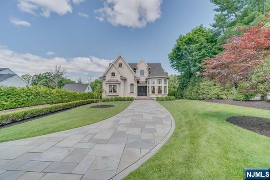 Welcome to NORTH CALDWELL 3900sq/ft, custom-built French chateau, where elegance meets luxury. The first floor features a grand double-story foyer, a spacious office, a grand room, an open kitchen, and a charming breakfast area. The formal dining room is perfect for hosting, while two bedrooms, a full bath, and a powder room offer convenience and comfort. Upstairs, the luxurious master suite includes an option to convert the closet into a nursery. A laundry room and versatile bonus room add functionality. The finished basement is perfect for entertaining with a family room, full bathroom, and kitchenette. A two-car garage provides ample parking and storage. Special features include a steel beam for added strength, a gas line by the Trex deck, and an under-deck Rain Away system. Enjoy the outdoor kitchen with a water line, and an inground Roman-shaped pool for relaxation and recreation. Security and convenience are ensured with custom motorized gates, and cameras.