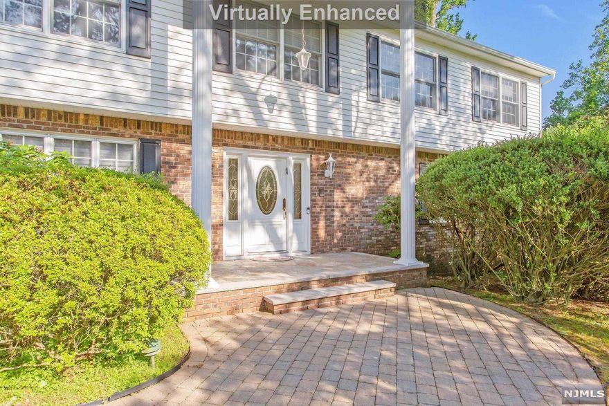 Stunning 5 Bedroom 3 Bath Magnificent Columned Center Hall Colonial on a Circular Cul de Sac of Beautiful Homes..BRAND NEW Expansive Composite Deck..Exquisite Kitchen w/Quartz Counters & Breakfast Room is the HUB of this home, & leads to the NEW Amazing Deck, Patio & PRIVATE Rear Yard, perfect for entertaining & your own Private Sanctuary..Wonderful Hardwood Floors..So many incredible & innovative updates & use of interior space..Immense front to back Family Rm/Fireplace..Large Living Rm..Banquet Sized Dining Rm..Guest Suite/5th Bedroom/Bath Main Level..Exceptional Primary Suite..Renovated Primary Bath w/IMMENSE Stall Shower..Spacious Walk in Closet..3 Additional Immense Bedrooms PLUS Renovated Main Bath..Lower Level Recreation Room..LED recessed lighting..BBHW multi-zoned heating..Oversized 2 car garage..Top Rated Schools..EZ NYC Commute by Car,Bus & Rail..Seasonal Farmer's Market..Exceptional Town Library..Picturesque Town Center w/Fine Restaurants..You will LOVE Living Here!