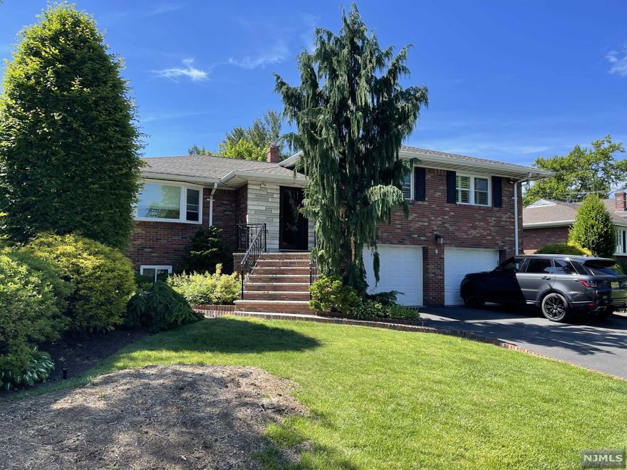 JUST REDUCED! Welcome to this North Cliffs immaculate move-in ready home, fully renovated in 2019. An entertainers paradise w/ a modern kitchen, large Island, Quartzite countertops & black SS appliances. Open floor plan, large DR w/ sliders out to large deck area & inground pool w/ new equip. LR w/ custom built in cabinetry. Just steps up to the wide hallway into the primary suite w/bath, ample closets, separate A/C & WD, the main bath and 2 large bedrooms complete this level. On the ground floor there is a family room w/ sliders out to the pool & a 1/2 bath. The Lower level with a walk out can be used as an in-law suite with it's own full kitchen w/ granite counters, add'l cabinets for storage and entertaining and another full bath & laundry room. Vinyl flooring on both lower levels & HW under carpet. 2 Car Garage. Updated underground sprinkler system. Custom window treatments throughout. Enjoy low taxes & close proximity to NYC. A must See property!