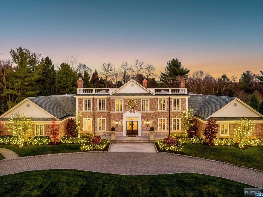 This magnificent, washed brick plantation mansion with its NEW wrought iron fencing, is a center hall masterpiece that has just gone through a complete interior refurbishing. The beautiful 2 story entrance foyer with bridal staircase is incredibly welcoming to this open, high-volume home. Designers' decor new bathrooms, custom trim package, complete custom paint package, 1st floor master suite 4 closets, sitting rm, private patio, 5 additional en-suite bedrooms and lower-level billiard rm, theater, gym package. Incredible grounds with mature plantings inground pool with double waterfall & jacuzzi, newer patios, circular driveway, full-house generator, & 3 oversized garages. Won't Last!!