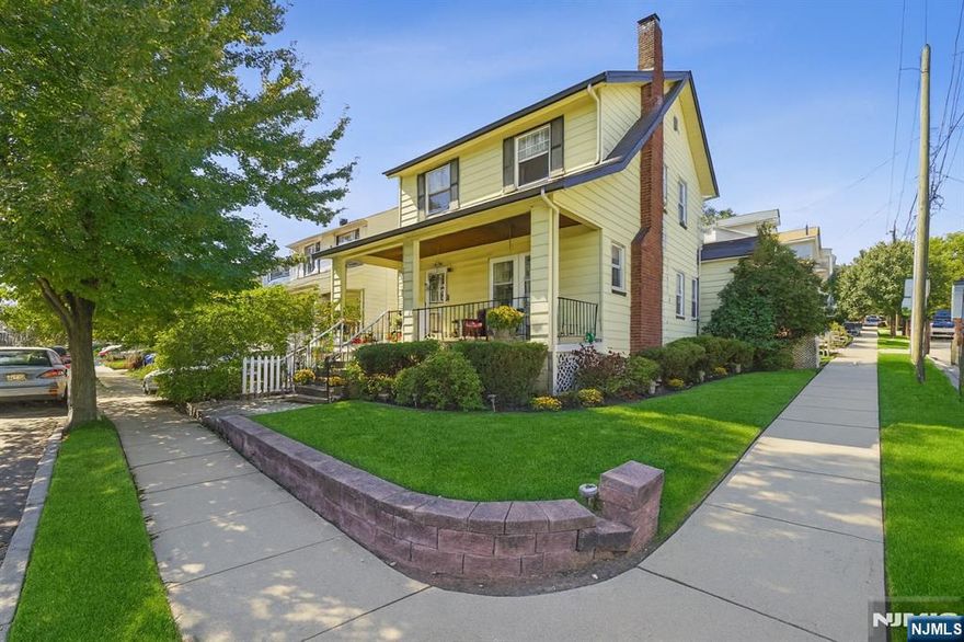 You will love to call this home! This cheerful corner home welcomes you with an inviting front porch, perfect for relaxing and enjoying quiet mornings or evening breezes. Sunlight pours through the many windows, highlighting the beautiful wood trim, gleaming hardwood floors, and classic details such as a charming wood-burning fireplace. The spacious family room offers a warm and comfortable atmosphere, ideal for both everyday living and entertaining. Additional features include a fully finished basement perfect for a home office, recreation area, or guest space and a third-floor addition offering flexible living options. The home is also equipped with smart home technology, including integrated voice-control capabilities, allowing for modern convenience and effortless living. Exterior lighting enhances both the front and backyard, creating a warm and inviting ambiance in the evenings. The low-maintenance backyard and detached two-car garage add both practicality and ease. Located in desirable West Orange, this home offers convenient access to shops, restaurants, parks, and major NYC transportation routes blending suburban comfort with city accessibility.