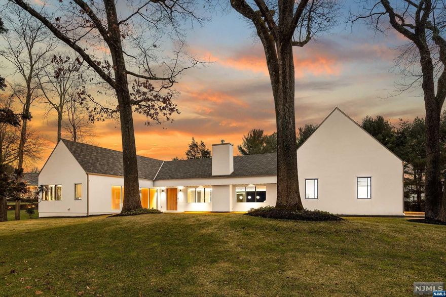 It's finally upon us, a modern contemporary ranch that is worthy of gracing the covers of Architectural Digest! Approx 6,000 sqft on one floor surrendered by glass walls and doors! The moment you enter the front door, you will realize the stark edifference. Drenched with natural sun-light this sprawling-ranch offers 5 bedrooms, 4.5 baths, 2 full kitchens (one chef kitchens), 3 car garage w/ 2 charging ports, & an in-ground gunite pool. The meticulous details include 6" oak flrs w/ 17 zones of radiant heat throughout, Kawneer windows, Ceasar Stone throughout, Dacor/Meile/Thermador/Sub Zero appliance package, Motorized blinds & Stuv FP. Additional 6,000 sqft walk-up second floor has the potential to be finished. 5 bdrm new septic/4 bdrm leach field. This home sits on 1 acre property on a stunning block just seconds from Indian Trail Club, Market Basket, community parks, miles of hiking trails & lakes! A true architectural anomaly!