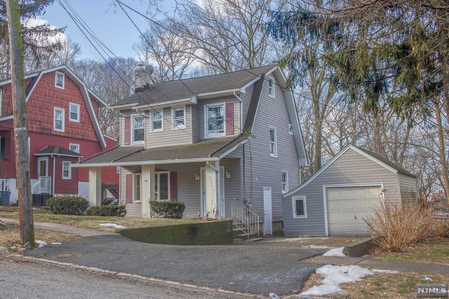 Commuters Dream & turn key ready! Walking distance to NYC bus stop, very close to multiple train stations, & 14 miles to Lincoln Tunnel. Located on a well maintained 50x143 lot on a dead-end street. This colonial has beautiful hardwood floors & new LED hi-hats throughout. 1st Fl. boasts a eat-in kitchen w/ loads of cabinet storage, dining room, living room, w/ brick fireplace, & half bathroom. 2nd Fl. has 3 well sized bedrooms & a full bathroom with a walk-up attic. The finished basement provides extra living space & laundry. Also, includes a spacious detached garage.