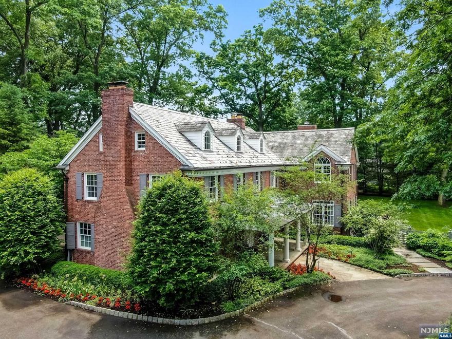 Bahr Rapaport 917.848.1784 and The Rapaport Group presents... Move right in to this hidden jam brick colonial on park-like shy acre flat property in the heart of old smith village! home was originally built in the 1930's and gut renovated and expanded in the two last years. flawless renovation. incredible commercial grade kitchen, beautiful marble baths, high ceilings, lots of light throughout. no detail overlooked: Slate roof, beautiful hardwood floors, finished third floor and lower level,4 car garage, stone driveway piers, and more! plenty of room for a swimming pool.