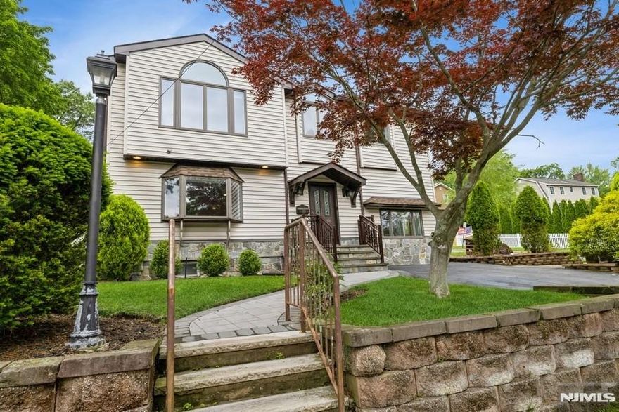 Welcome home! Beautifully maintained four bedrooms, three full bathrooms in the heart of coveted Cresskill, featuring impeccable hardwood floors, abundant natural light, and a seamless flow through the formal dining room, living room, and spacious eat-in kitchen with sliders leading to a fabulous backyard - complete with patio and built-in barbecue, perfect for entertaining! All bedrooms boast the same modern feel with its stunning hardwood floors and perfect finishes. Convenient finished lower level allows for flexibility in whatever suits your lifestyle; at home gym, office, or playroom/rec area. Located near parks, blue ribbon schools, and NYC transportation! Truly a gem offering comfort, style, and convenience. A must see!