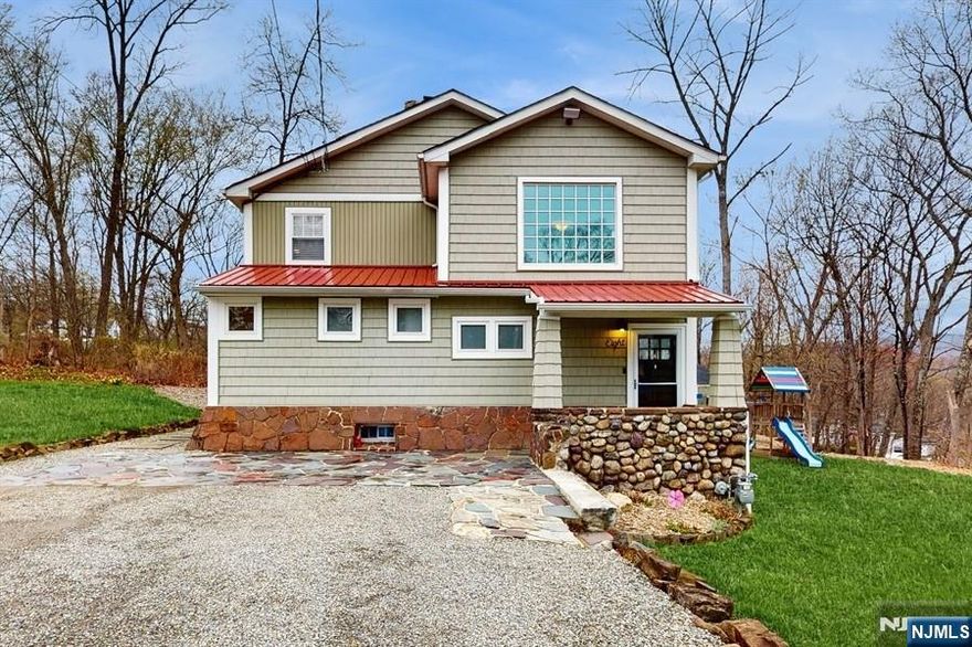 Discover classic charm and modern comfort in this beautiful custom home on nearly an acre in Montville's Towaco section. Originally built with quality craftsmanship, the home was fully updated in 2016 to combine timeless featuresâ€”like exposed ceiling beams and a wood-burning fireplaceâ€”with an open, modern layout perfect for entertaining. The spacious living room connects to a gourmet kitchen and bright dining area, ideal for both cozy dinners and larger gatherings. French doors lead to a deck with a sleek gas fire pitâ€”great for relaxing evenings outdoors. There's also a stylish home office and a convenient powder room on the main floor. Upstairs, the peaceful primary bedroom is joined by two more bedrooms and a spa-like full bathroom with a soaking tub, walk-in shower, and nearby laundry room. A second full bath with a modern shower is located on the main level. Enjoy a perfect mix of elegance, comfort, and convenience in a prime location.