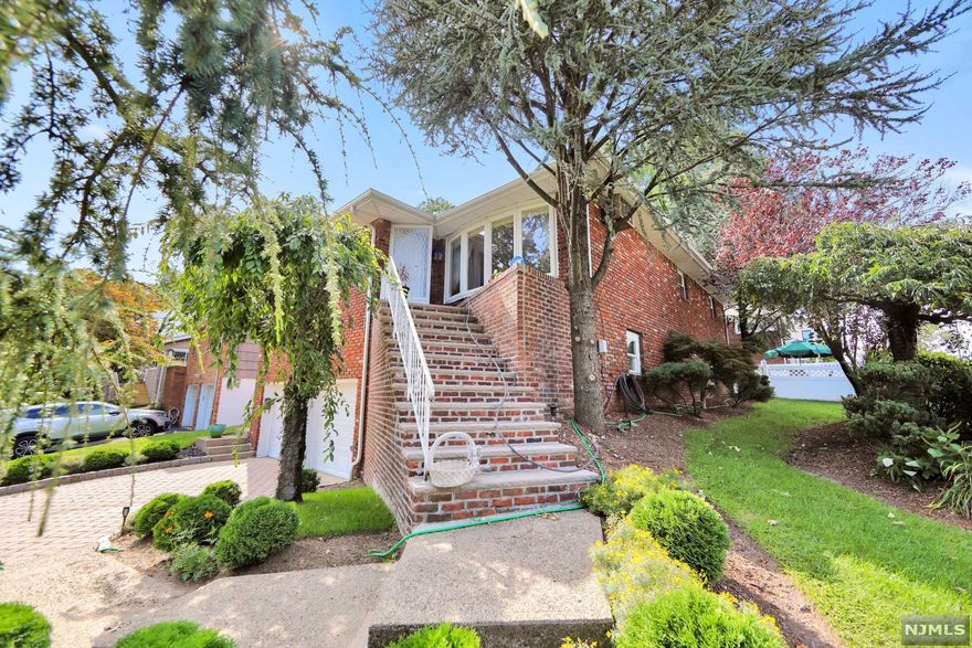 Come fall in love with this FIRST time on the market ALL Brick home, built in 1968 on the southern part of Fort Lee (corner of Deerwood Rd. and Kingsland Lane) within one block to Inwood Terrace Park and only 20 min to mid-town Manhattan. Perfect Location.This beautifully landscaped two level home has fantastic natural light beaming in from the large windows and hard wood floors throughout. The home offers 3 Bedrooms, 2and half Baths, Large Formal Living Room and Dining room. The downstairs open concept living quoters are great for extended family Large Family room with a wood burning fire place, Dining Room, Full Bath as well as updated Kitchen with private separate entrance.Enjoy the large back yard with a nice size patio for your summer entertaining or just relaxing under the shaded tree. Amazing sunset views from the upper level! Two floors, use as an Extended Family home, 1st level above ground. Quiet and Private suburban home, 5 minutes to George Washington Bridge.