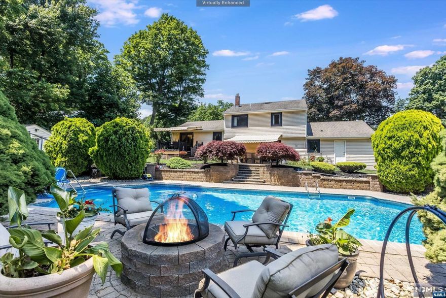 Welcome to your own private paradise! This stunning 4-bedroom, 3.5-bath home offers a refreshing swimming pool, surrounded by lush trees and a charming patio, creating the perfect setting for relaxation and entertainment. As you step inside, the ground level features an in-law suite, a true hidden gem, complete with a cozy living room, dining area, kitchen with granite countertops and stainless steel appliances, a comfortable bedroom, a full bath and powder room. Sliding doors from the dining area open to the patio, offering a seamless indoor-outdoor living experience designed for both comfort and convenience. First floor has a living room, dining room and an updated kitchen featuring a convenient granite island with seating. The upper level is a dream, boasting three generously sized bedrooms and a luxurious spa bath with a rejuvenating jetted tub, providing a serene retreat after a long day.This home is perfect for entertaining, offering not just a living space, but a lifestyle.