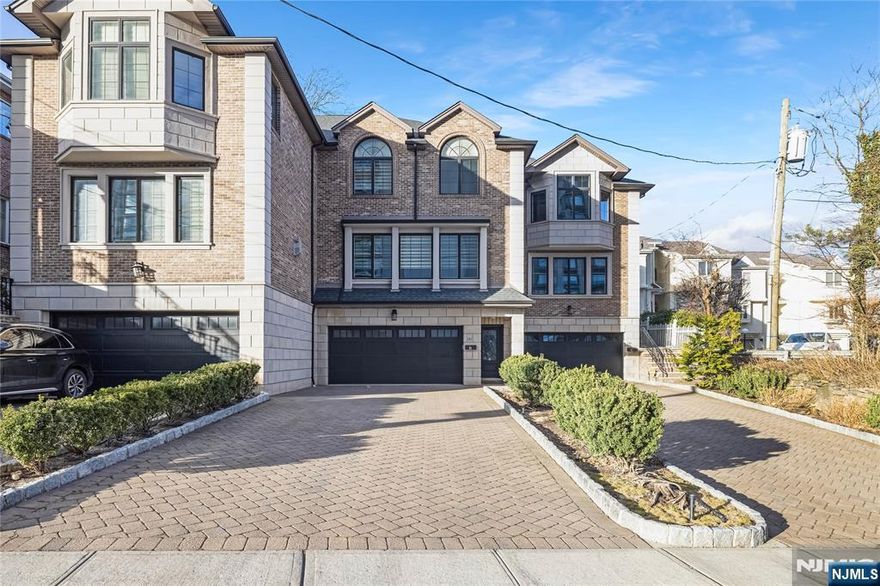 This beautiful brick and limestone townhouse features an open floor plan with gleaming hardwood floors throughout. The spacious living room boasts a cozy gas fireplace, perfect for gatherings. The open kitchen is a chef's dream, equipped with stainless steel appliances, a center island for meal prep and casual dining, and doors that lead out to a private, fenced-in yard. The master bedroom is generously sized and includes a luxurious en-suite bathroom. Two additional bedrooms are also spacious, providing ample space for family or guests. This unit offers the convenience of a 2-car garage and in-unit laundry facilities. Close to transportation, shops and eateries!!