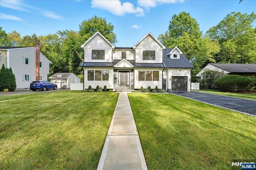 Stunning New luxury colonial home in one of the most sought after Bergen County towns, this will not last long. The first floor offers 10 ft ceilings, Mudroom, Laundry, attached garage open concept living with sliders to the backyard. Second floor offers a stunning primary suite with oversized bathroom, 4 more Bedrooms, 2 baths including a jack and jill and a second laundry room for added convenience. The large expanded basement offers a bonus living area for extra enjoyment, This home has wood flooring, upgraded appliances and mechanicals, pre wired for Audio Visual and Security systems.