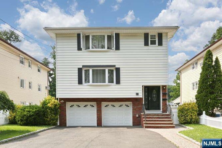 Located on a beautiful and quiet street in Elmwood Park, this beautiful, spacious and well-maintained 3 bedroom 1st-floor unit offers comfortable living with plenty of space and flexibility. This rental includes a BONUS ground-level STUDIO with high ceilings, a private entrance, full kitchen & bathroom making it ideal extended house hold members, home office or gym space! Additional features include, large shared yard with patio and privacy fence, 1-car garage plus 2 designated driveway parking spaces, newer washer and dryer on the ground level and small storage area! Located just minutes from major shopping centers, restaurants, highways, and all NYC transportation! Pets negotiable, under 25lbs for additional fee. Credit/ Income verification and tenant insurance required. Schedule a private tour today!