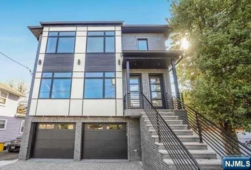 Back on the market: The buyer's mortgage denied. Introducing brick exterior, bright two family, top and bottom modern new construction. (One year young) This home features sun-filled rooms with 9'ceilings throughout. Both first and second floor features spacious living room, modern gourmet kitchen, 3 bedrooms and 2 full bath with a deck. The master bedroom has an en-suite bathroom, complete with a modern glass-enclosed shower. Finished basement offers very large family room, a bedroom recreational/gym etc. sliding door to back yard, side door. This is a great opportunity to live on one floor and rent the other or rent both units for the investors. Great income producing property Near GWB and ALL highways. Short walk to bus to NYC, shopping, supermarkets, schools, dozens of great restaurants