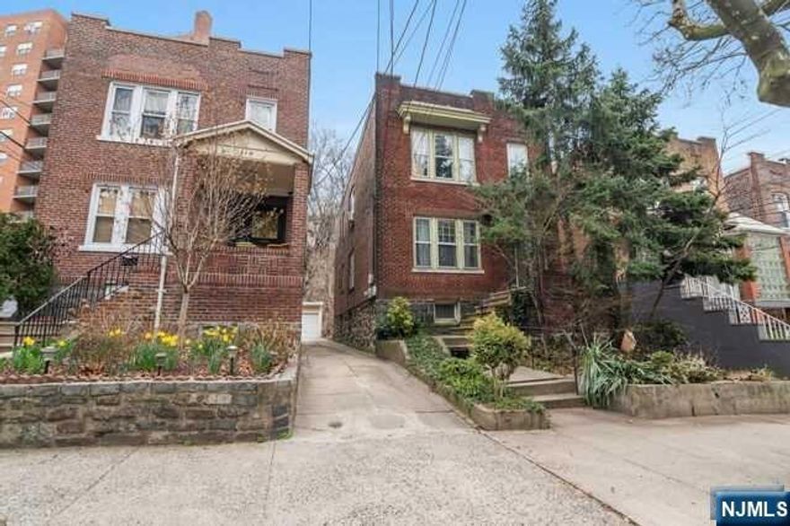 Rarely available 2 family home w/2 car detached garage & parking on prestigious Boulevard East - Perfectly maintained and updated by the current owner yet still holds some unique, original details. Owner's first floor apartment has 2 bedrooms, 1 bathroom, a living room, formal dining room, and a fully equipped kitchen with stainless steel appliances, high ceilings and hardwood floors throughout. The owner had custom built hardwood decks put on both units, directly accessed through the kitchens. The decks then lead to a large driveway and wooded hill behind the garage affording privacy. Unit 2 also features 2 bedrooms, a bonus den, and 1 bathroom. There is a fully equipped custom designed kitchen with stainless appliances, granite counter tops, floor to ceiling back door, and washer/dryer. Close t