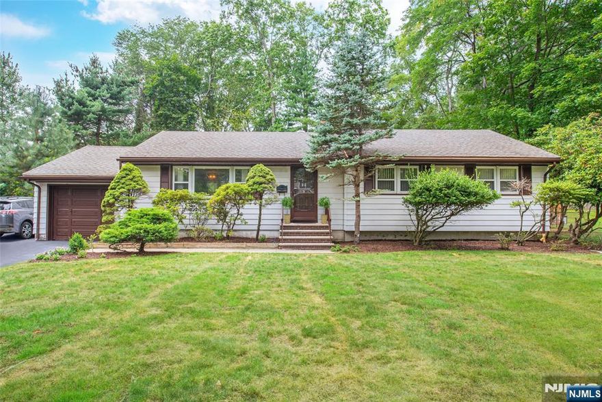 Highest and Best Scheduled for Tuesday 9/9 by 6PM. You will immediately feel welcomed the second you enter this 3 BR/2 BTH Ranch situated on a quiet street in one of Bergen County's most desirable communities. Upon entering, you will be greeted to a spacious Living Room drenched in natural light. The gorgeous hardwood floors throughout flow seamlessly into the banquet sized Dining Room. Imagine preparing your favorite dish in the Modern Eat in Kitchen while your guests enjoy a glass of wine out on the deck. Wander down the hallway and you will find the Primary Bedroom Suite with a a WIC & ensuite Bath. The floor is made complete with 2 additional Bedrooms that provide ample closet space & a full hallway Bath. The lower level is designed for versatility and enjoyment, offering a Rec Room, Home Theatre, Bar, Office, Workshop, Gym, and Laundry Area with direct access to the attached 1-Car Garage. Situated on nearly half an acre, this property boasts a park-like backyard, providing both a private oasis and an ideal setting for entertaining. Appreciate all that living in River Vale affords you: close proximity to top-rated schools, parks, restaurants, shopping & an EZ commute to NYC.