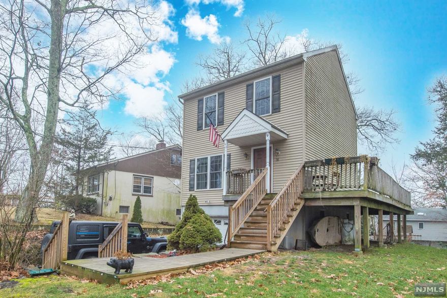 Welcome to this 2 Bedroom, 1.5 Bath Colonial In Upper Greenwood Lake Community. Spacious Eat in Kitchen with Sliders to Oversized, Wrap around Deck. Views of the Lake from All Sides! Partial Unfinished Basement with Laundry, 1 Car Attached Garage. Upper Greenwood Lake Community Offers Members Only Beach & Clubhouse, Dock Opportunity, Motor Boating, Kayaking, Swimming, Fishing, Jet Skiing & More! Plus Year Round Activities! Just 1 Hour To NYC & Close To Major Highways, Shopping, Dining, Golf Courses, Ski Resorts, Wineries, Apple Orchards, Drive-In Theater & So Much More! Don't Miss This One