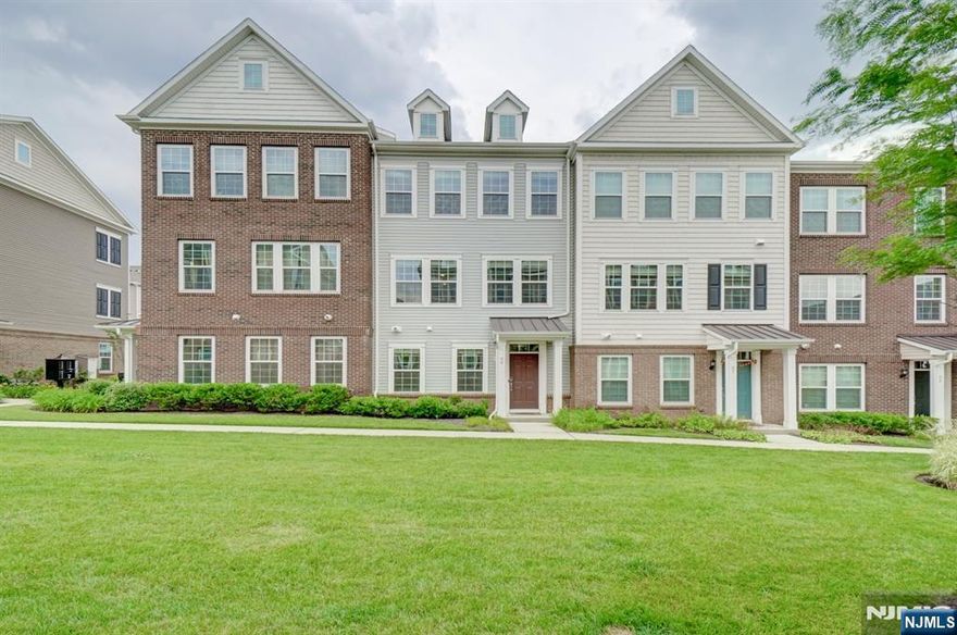 CALL 732.789.0670 to tour the home. Welcome To This Magnificent 4 Bedrm, 2 full 2 half Bath END UNIT TOWNHOME in the desirable Liberty Square @ Wesmont Station community. Experience a sleek & chic interior featuring an open floor plan. Get welcomed by the landscaped courtyard overlooking from the home. 1st fl offers bedrm w/ half bath which is perfect for home office set up OR can be used as a guest bedroom. End Unit townhome features EXTRA WINDOWS creating a bright and sunlit living room. 2nd Fl provides modern Living & Dining rm, Kitchen w/ gorgeous upgraded cabinets w/ high-end granite countertops, GOURMET APPLIANCES & huge center Island, backsplash, upgraded sink, huge walk-in pantry, upgraded hardwood floors. Head upstairs into an INCREDIBLE master suite featuring tray ceiling, HIS & HER Walk in Closets, Master Bath w/ double vanities + standing shower, Bedrms 2 & 3 w/ Bath 2 & all bedrooms with upgraded carpets! Enjoy Luxury Of PARK & NJ Transit Train Stop Right At Your Doorstep