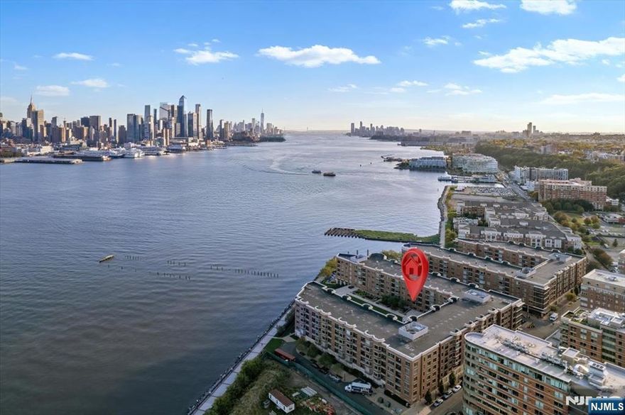 This exceptional 2-bedroom, 2-bath condo on the Hudson River waterfront is bathed in natural light and boasts a range of modern amenities. The spacious layout features a gourmet kitchen with elegant granite countertops, Viking and Sub-Zero stainless steel appliances, and a built-in dual-zone wine cooler and beverage centerâ€”perfect for entertaining. Throughout the home, hardwood floors are complemented by custom base and crown moldings, adding a refined touch to every room. Step outside to a charming balcony, where you can enjoy stunning views of the surrounding area. Convenience is key with an in-unit washer and dryer, ensuring ultimate comfort and ease, and 1 indoor parking. The building offers a variety of on-site amenities designed for both relaxation and convenience, including shopping options like Starbucks, Acme, and Ben & Jerryâ€™s, an indoor parking spot, a pool, a gym, a residents' lounge, children's playrooms, and a beautifully landscaped outdoor patio/yard. Grandview II offers newly renovated hallways, lobby, and gym, providing an updated and modern living experience. For commuters, this prime location offers easy access to NYC via bus, the Port Imperial Ferry, and the Light Rail.