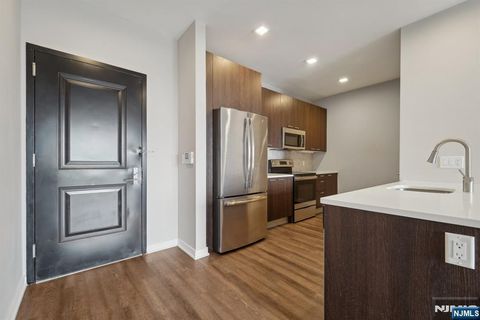 Photo of 295 Polifly Rd #608, Hackensack, NJ 07601 (MLS # 26009948)