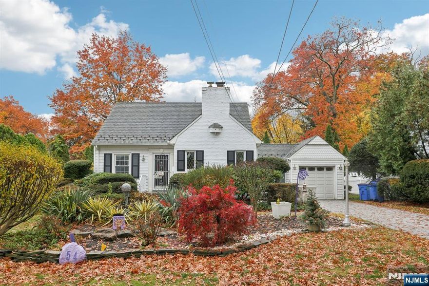 Lovely, charming colonial cape home located in the upscale and desirable Borough of Tenafly, a top town with highly ranked schools. Located on an attractive 75'x107' (approx) property near New York City transportation, shopping, restaurants and the Stillman elementary school. You'll feel right at home in this inviting and welcoming home, reminiscent of an English cottage complete with a gorgeous garden and professional landscaping. Good-sized living room, 1st floor office or possible bedroom, modern kitchen with stainless steel appliances, half bath, dining room, breezeway to attached garage, 2 additional bedrooms on second floor with nice updated full bathroom. Full basement is partially finished. Upgrades include freshly painted, updated electrical, newer hot heater, house generator and underground sprinkler. All Offers must be in writing with pre-approval and/or proof of cash funds.