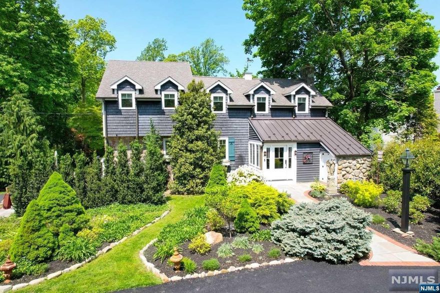 Welcome to this Beautifully Renovated 3BR,3.5 BA Stone & Cedar Country Home. Situated on a private .94ac. Professionally Landscaped Property w/landscape lighting. Enter into a warm & inviting Stone & Brick Entry Foyer w/Vaulted Ceiling. This opens to the Great RM W/Stone Fpl, Boxed Beam Ceiling & Formal Dining Area. The kitchen W/Center Island, Viking Stove, Gaggenau Steamer & Subzero Refrig will satisfy the most discerning of chefs. The sun-drenched Breakfast Area w/built in Banquet opens to Stone Patios W/Outdoor Kitchen & Fpl. Overlooking the lush backyard retreat. Upstairs offers a Stunning Primary Suite W/WIC, and Bath W/SS, dual vanity & Jac, BR#2 Ensuite, BR#3, Hall BA, & Laundry. The LL features a Gym/Rec Rm W/OE, Storage Rm & 2 Car Garage. The Backyard Walk leads past the Shed to another Blue Stone Patio W/Fire Pit. This one-of-a kind home has an abundance of Character & Architectural details inside & out! Enjoy the Top Rated Saddle River Schools as well as the Low Taxe