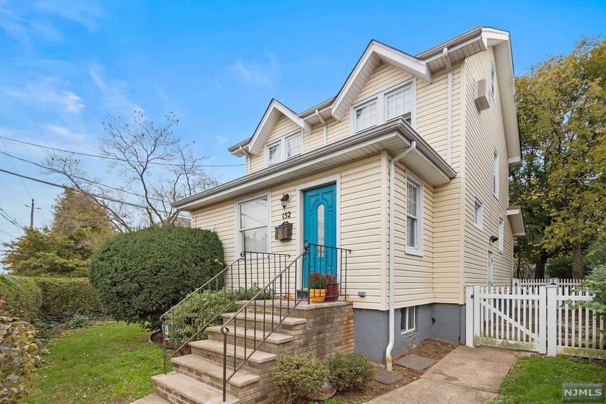 (Property known as 152 E. Main St.). Great starter 2 family in very convenient location. 1st floor has large modern eat in kitchen, living room PLUS den/office, modern bathroom. 2nd floor is bright & spacious with oversized eat in kitchen and walk up attic. Full, partially finished basement. Bus at door. Very close to shopping.