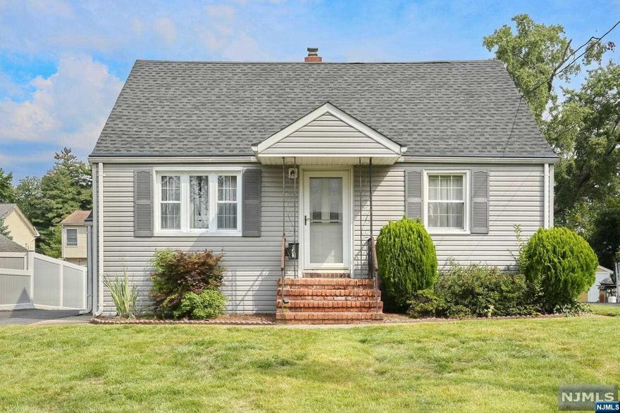 Classic cape cod home on quiet street! Living room opens to eat in kitchen, two good size bedrooms and bath on first floor. Upstairs two more large bedrooms and convenient half bath. Basement with high ceilings is semi-finished with French Drain water proofing, loads of potential! Hardwood floors, gas hot water baseboard heat, split unit air conditioning! Maintenance free vinyl siding, oversized one car garage. Terrific location close to school & NY transportation.