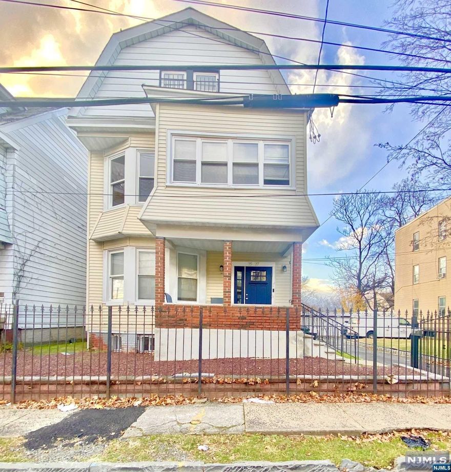 Come explore this charming 2-family - Double Lot home which was fully gutted and renovated in 2008. Each unit offers three bedrooms. Unit 2 is unique, as it offers 2 bedrooms and 1 full bath on the first level and the second level of unit 2 offers a primary bedroom and en suite bathroom. There is also a very a beautiful patio that offers tons of natural sunlight. One of the best amenities is the 3-car garage plus additional black top parking. Located near local transportation, this property offers both comfortable living and rental potential. Don't miss your opportunity to own this gem!