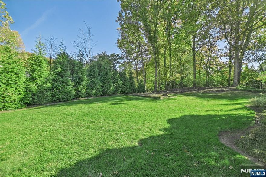 Exquisite Center Hall Colonial home with 5 bedrooms and 4.5 bathrooms situated on 2/3 acres seamlessly blends classic charm with modern luxury. Grand circular driveway leading to a home that exudes timeless elegance with an inviting flow and abundant natural light. Inside, discover impressive millwork, oversized windows, and intricate detailing that elevate every space. Foyer leads to formal Living Room seamlessly flowing into an expansive Great Room -both with French doors to deck + yard. Sunroom with soaring cathedral ceilings. Dining Room leads to gourmet Eat-In chef Kitchen. Family Room and Powder Room complete 1st level. 2nd level features an opulent Primary Suite with a private office/sitting room overlooking the Sunroom, dual walk-in closets, and a spa-like bath. Finished lower level provides a media room, recreation space, full bath, storage + direct access to attached 2-car garage. Enjoy access to top rated Millburn Schools, shopping, and direct NYC train access.