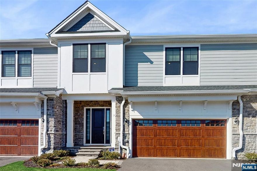 Welcome to the stunning Elgin Model built in 2023, a luxurious townhome located in The Fairways at Edgewood. This sun-filled home features soaring ceilings, gleaming solid hardwood floors throughout, and a bright, modern open-concept layout. The welcoming foyer opens to a spacious living room with floor-to-ceiling windows, filling the main level with natural light. The chefâ€™s kitchen is thoughtfully designed with custom white cabinetry, a center island, and high-end stainless steel appliances. The elegant dining area flows seamlessly to a private paver patio complete with a built-in outdoor grillâ€”perfect for entertaining. A powder room and custom upgraded pantry from California Closets complete the main level. Upstairs, the luxurious primary suite features two custom closets from California Closets and a spa-like bath with soaking tub, glass-enclosed shower, and double vanity. Two generously sized bedrooms, a stylish full bath, and a spacious, convenient laundry room complete the second level. The finished lower level adds a spacious recreation room and a brand-new full bath. An attached two-car garage includes a Vacuflo Central Vacuum and Level 2 EV Charger. Additional highlights include an elegant electric fireplace with white stone, premium custom window treatments from The Shade Store (including a motorized patio door blind), and a fully integrated smart home system with Ecobee thermostats, Schlage smart lock, and Nest doorbell. Donâ€™t miss this rare opportunity!