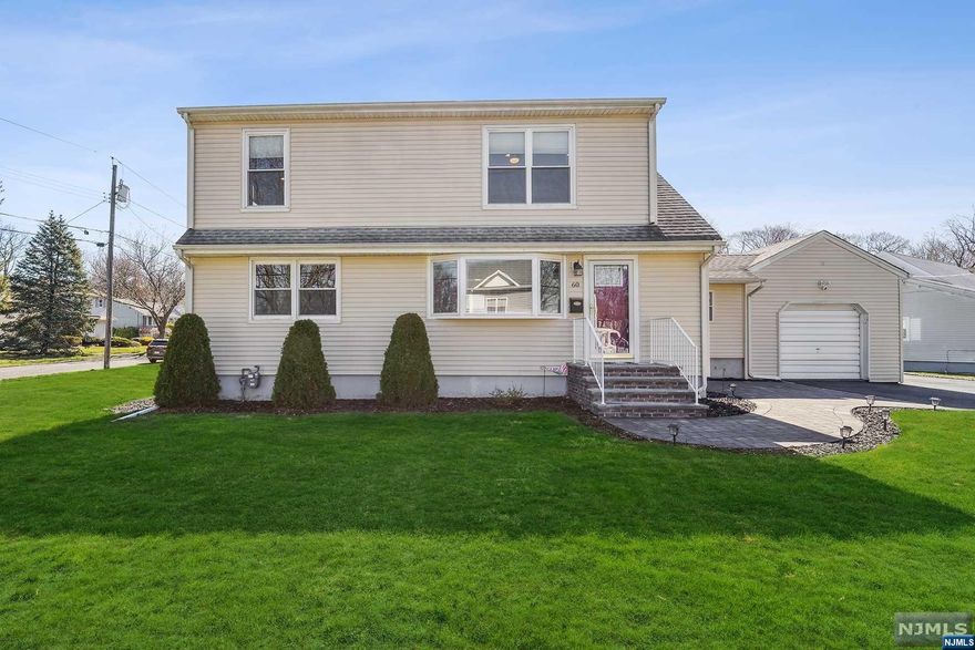 Welcome to this bright & spacious expanded Cape located on a quiet street in the desirable Allwood section of Clifton. This immaculate 4 bedroom, 2 bath home offers modern upgrades throughout. Step into the spacious mudroom which provides access to oversized 1 car garage as well as backyard. Gorgeous eat in kitchen features island, custom cabinets, granite counter tops, and stainless-steel appliances, which opens up to large living room/dining room combo. Home offers 4 spacious bedrooms; 2 upstairs which both feature walk in closets, and 2 downstairs, plus a beautifully updated full bathroom on each floor. Large level property with vinyl fenced in backyard complete with paver patio perfect for entertaining. Full basement with laundry and ample storage space. Updated electric, newer hot water heater, hardwood floors, central air, recessed lighting, lots of storage, and more! Conveniently located near highways, public transportation, parks, schools, shops, & restaurants.