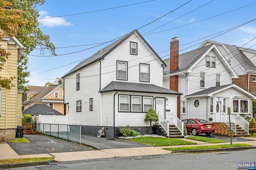 Stunning 3-bed, 2-bath home located in desirable Arlington section of Kearny completely gutted and renovated in 2019. Modern open floor plan perfect for entertaining. Chef's kitchen features white shaker cabinets, SS appliances, quartz countertops, grey subway tile backsplash, and coveted island for additional prep and serve space. Sliding doors off kitchen leads to the backyard with new privacy fence, paved asphalt driveway, and 2-car garage. Full bath with walk-in shower on 1st floor and full bath with tub/shower combo on 2nd floor. 3 generous sized bedrooms on the 2nd floor with pull-down attic access for extra storage. Finished basement with rec room and laundry area with access to the yard through Bilco doors. Roof, siding, plumbing, electric, floors, windows, walls, recessed lighting, hot water heater, central air & forced hot air heat (including ductwork) all from 2019. The only thing left for you to do is pack your bags and move in!