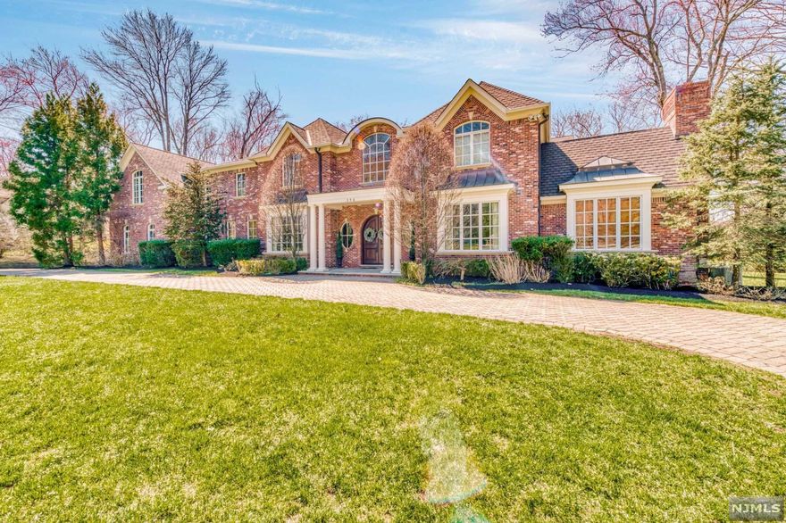 Grand living at 356 Indian Trail Drive! Refined all brick colonial designed and built by region's most highly acclaimed builder. This mini estate is located in West Gate Urban Farms on 1.31 unparalleled private and lushly landscaped acres that back up to the Greenacres Preserves. Stunning 2-story marble floored foyer opens to an elegant great room w/walls of windows,wet bar& FPL. Beautiful wood paneled library w/built-ins and FPL , banquet-sized dining room, chef's kitchen w/ center island, breakfast nook, & top of the line appliances, 10 FT ceilings, hardwoods throughout are among the lush features of this home. The second floor is comprised of a remarkable MBR suite w/ FP, his/her closet, sitting room and spectacular MBATH. 4 additional bedroom suites. Very private backyard with bluestone patio, circular paver driveway and more...Very close to center of town and Indian Trail Club