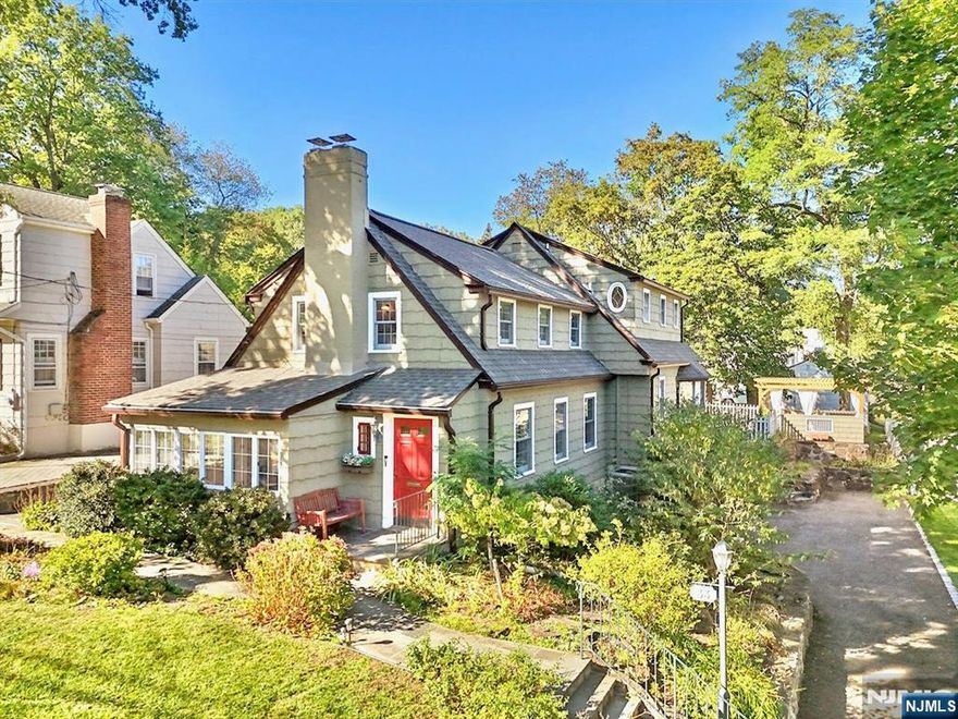 Welcome to this stately Willard school Colonial, where chic updates throughout include fresh paint, wallpaper & wood slat walls, Artemide Logico hand-blown glass chandelier, & water filtration. Great layout with living room/ Fpl, quiet den, dining room, breakfast room & sun-drenched family room/Fpl with bay windows & French doors leading out to the flat backyard. Classic Ulrich kitchen with SS appliances & double wall oven, enhanced by new pulls & faucet.. 2nd floor expansive primary ensuite with spa-like bath, 2 spacious bedrooms, hall bathroom & laundry. Lower level with full bathroom renovated to include an office & rec room with wet bar, offering walkout access through the oversized attached 2-car garage. Outdoors, explore beautiful tiered gardens with new fencing, sprinkler system & Pergola for endless recreation. Newer roof & water heater. Newly installed sidewalks connect you to everything Ridgewoodâ€™s vibrant downtown has to offer: Graydon, parks, shops, & transportation!