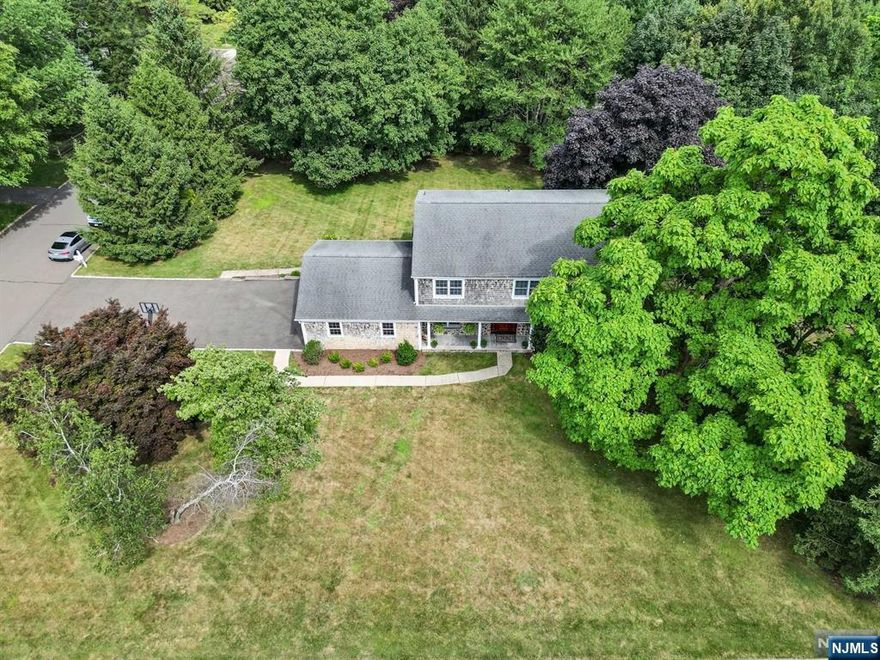 Beautiful center hall colonial in ultra desirable USR offers 4 bedrooms & 3.5 full bathrooms. Home has great curb appeal with an inviting front porch with stone & cedar shake siding & meticulous landscaping. Gourmet kitchen w. Ken Bauer solid maple cabinets, granite countertops, Viking & SubZero appliances & a breakfast nook w. French doors to a generous deck that overlooks the park like grounds.Oversized 2 car garage. Meticulously maintained home, nothing to do but move in. Wonderful community, convenient train to NYC & excellent schools.