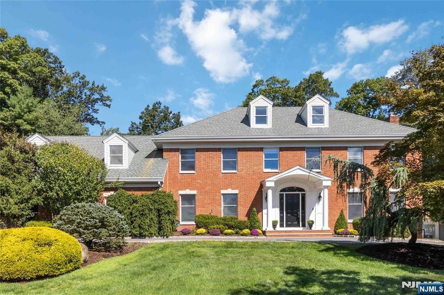 Located in, Cobblestone Crossings, on a Cul de sac and set on over 1/2 acre of beautifully landscaped grounds, this impressive, 6 bedroom, 4.5 Bath, brick faced Colonial offers the perfect balance of timeless elegance and modern comfort. A circular driveway and handsome stonewall was rebuilt in 2021 and provides a striking first impression. This desirable home features a spacious, marble foyer, Powder room, a formal dining room with floor to ceiling windows, a sunken living room with gas fireplace, French doors to a Great room with wood burning fireplace, fully equipped wet bar with custom cabinetry, Quartz counters and dishwasher . The Chefs Kitchen offers granite counters, with a dedicated pastry height counter, top of the line appliances and slider out to backyard Oasis with built- in outdoor kitchen, Salt Water pool and manicured landscaping. There is a first floor bedroom w/ full bath, laundry, expansive pantry and access to 3 car garage. The 2nd floor features primary bedroom with renovated, primary bath and walk in closet. Four more bedrooms, full bath, custom Cherry library/home office and a spiral stair case for easy access to 1st floor. A finished lower level includes, wet bar, Billiards, Recreation space, Full bath and walkout access to the backyard. Highlights include: whole house generator, Budd Vac, Skylights, Roof 7 years old, Kegerator, wine fridge, Beverage fridge, and much more! Do not miss this opportunity!!