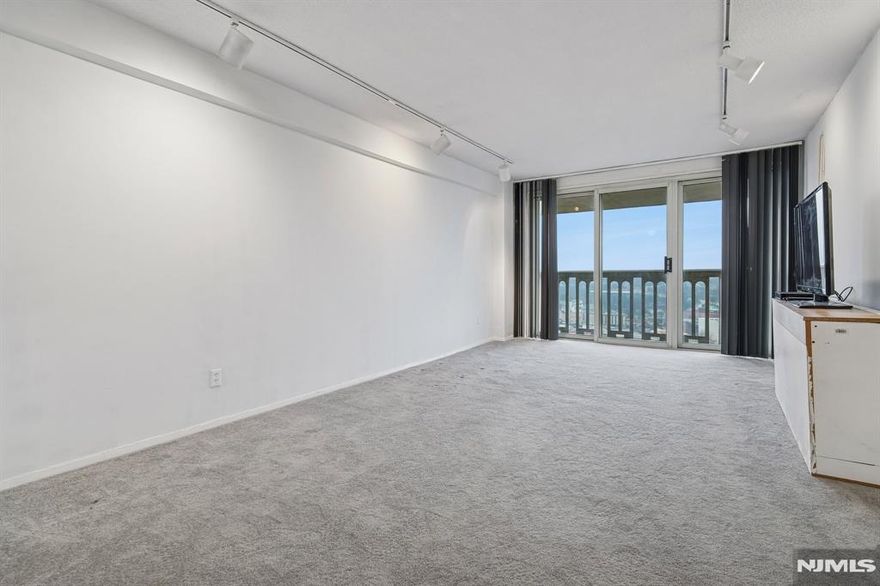 1 bedroom, 1 bathroom on 19th floor with mountain views. The kitchen features warm wood cabinets with an open concept. There is a spacious terrace facing mountain views. Maintenance includes re tax and all utilities. Board approval required. Garage--$60.00 per month, building is wired for Fios and Spectrum. Spectrum bulk cable package--$64.00 per month. OUTDOOR pool, new gym, community room, tennis, pickleball, basketball. NJ Transit 158 at the door. Approximately 819 sq. ft. plus a terrace.