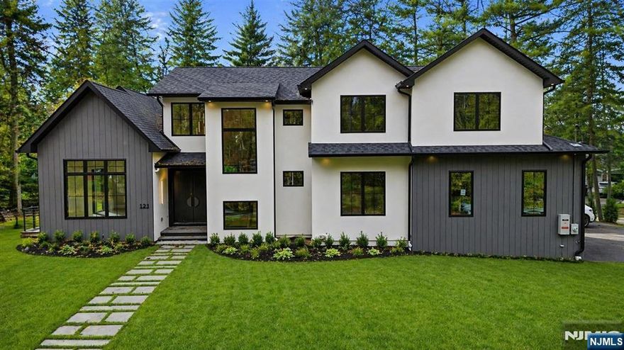 Luxury takes center stage in this remarkable new custom home on 0.35 acres. Dramatic one and a half story ceilings elevate the dining room, living room, and family room, complemented by oversized windows and high end designer finishes throughout, creating an atmosphere ideal for elevated daily living and entertaining. The chefs kitchen serves as the homes centerpiece, featuring custom cabinetry, quartz countertops, professional stainless steel appliances, and a large waterfall island with seating. The main level also includes a first floor guest suite, mudroom, and powder room. Upstairs, four spacious bedrooms feature nine foot tray ceilings, including a luxurious primary suite with two custom walk-in closets and a spa-like bath with soaking tub and double vanity. Additional highlights include oak floors throughout, radiant heat in all full bathrooms, a central vacuum system, and extensive custom millwork. The fully finished lower level provides flexible living with a rec room, gym area, ensuite bedroom, dedicated wine storage with glass door, and pre wired home theater. Enjoy an oversized heated three car garage, generator, multi zone HVAC, full landscaping package, outdoor gas hookup on the covered porch, and a ten year home warranty. A rare opportunity to own new construction in a prime location, move in ready luxury with every detail thoughtfully crafted.