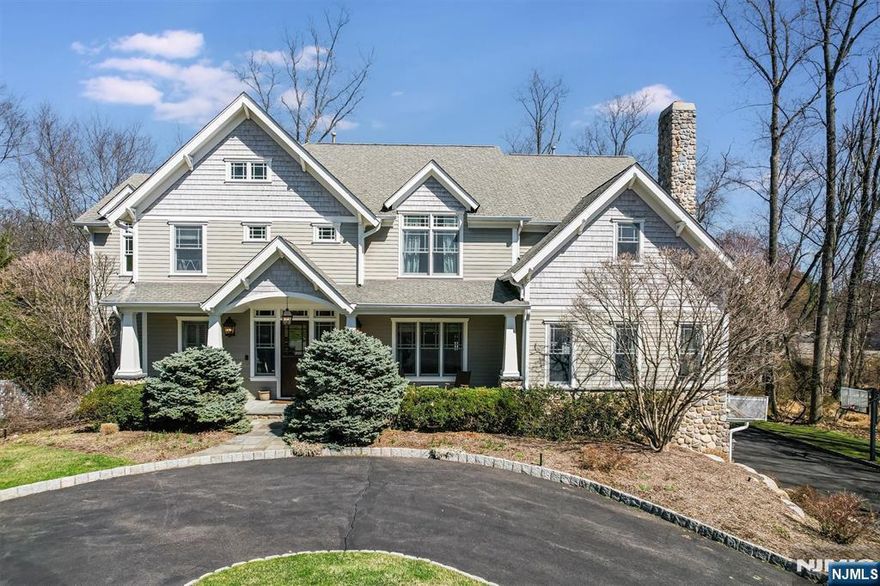 Stunning Custom built home by renowned Builder John Haboob in 2008 showcasing a blend of Classic Colonial and American Farmhouse Architectural design. This over 5,000 sq ft home sits beautifully on a cul-de-sac in one of the most desirable neighborhoods in Wyckoff. First floor boasts open floor plan with 10 ft coffered ceilings, hand-laid, oversized fireplace, eat-in chefs kitchen, large dining room and a spacious ensuite bedroom. Additional unique features include a full house generator, two laundry rooms, a second floor primary suite with attached office/bonus room giving a total of 5 bedrooms and 5.5 baths along w/ a finished basement w/full bath and mudroom adding an additional 1,000 sqft of living space. The private fenced lot offers a large deck and gorgeous stone fireplace framed by a lattice pergola and an 8-person spa, backing to the woods creating the most picturesque backyard perfect for family and entertaining. Nickole Bello Compass 201.953.6895 Nickole.bello@compass.com