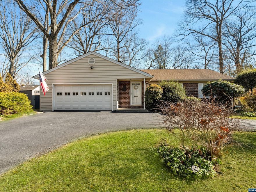 Hidden Treasure! Everything you've been looking for is right here! This updated and well maintained ranch offers the convenience of one-floor living and is nestled on 1/2 of an acre on a quiet cul de sac. This home features a spacious formal LR w/wood-burning fireplace and dining area. The updated EIK features granite countertops, new appliances and lovely large windows that offer a perfect view of the expansive backyard. Sliding glass doors lead to a large deck. Additional features include a king-sized BR with walk-in closets, French doors leading to the rear deck, 2 full baths, full partially finished basement, and storage galore. Hardwood floors throughout. Circular driveway accommodates 5 vehicles. Top-rated schools. A must-see gem!