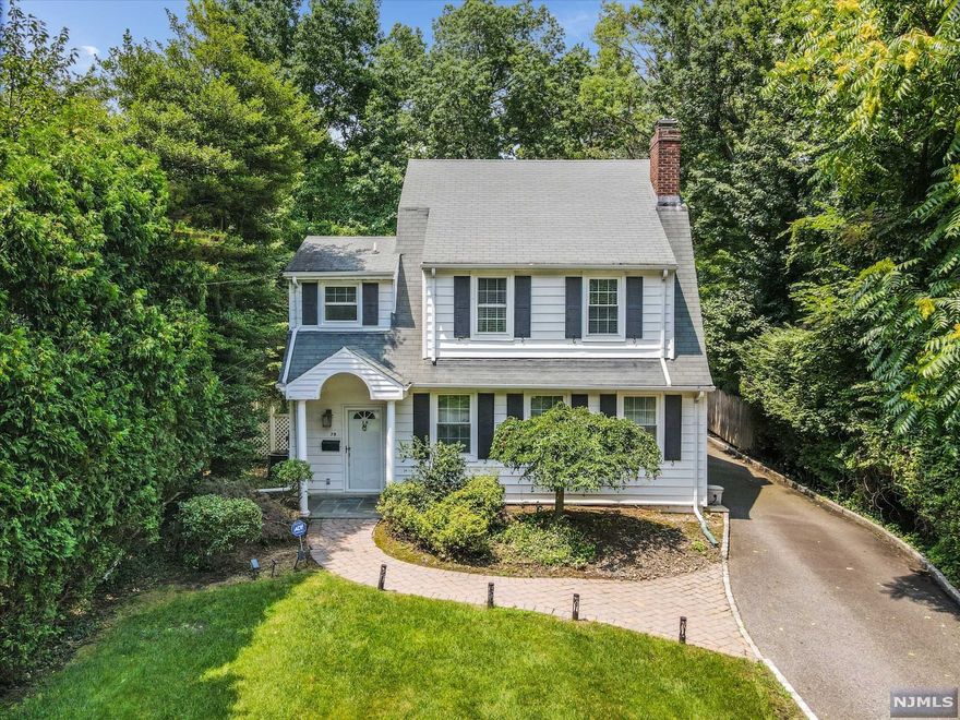 Located on one of Tenafly's most coveted East Hill streets, this side hall colonial features 4 bedrooms and 2.5 baths. The elegant living room has a fireplace and built-ins which open to the formal dining room, family room and bright kitchen. The second floor offers a master suite, 2 additional bedrooms and another full bath. The third floor features another bedroom, office or play room. There is also a finished basement, generator and a 2 car garage. A great opportunity to buy a classic Tenafly home in a premier location
